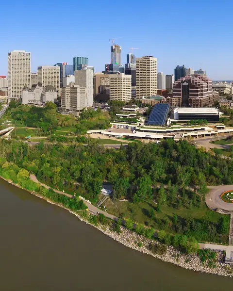 Aerial view of the North Saskatchewan River, the green river valley and downtown Edmonton with the Alberta Legislature grounds